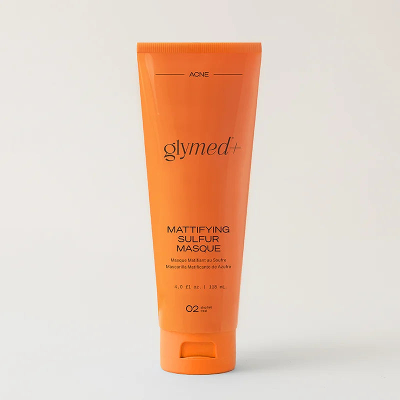 Orange tube of glymed+ Mattifying Sulfur Masque on a light gray background